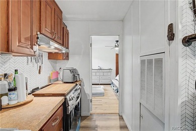 Step inside to find modern luxury vinyl plank (LVP) flooring - photo 6