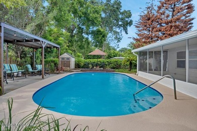 Welcome home to this inviting 3-bedroom, 2-bath pool home - photo 2