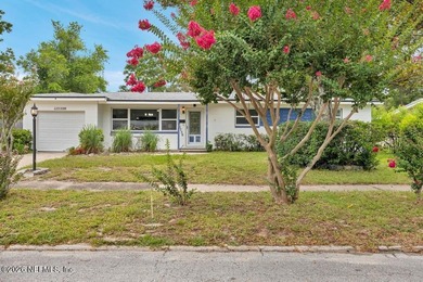 Welcome home to this inviting 3-bedroom, 2-bath pool home - photo 3
