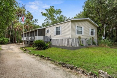 Tucked away on a beautiful wooded 1-acre waterfront lot in the - photo 2