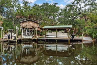 Tucked away on a beautiful wooded 1-acre waterfront lot in the - photo 3
