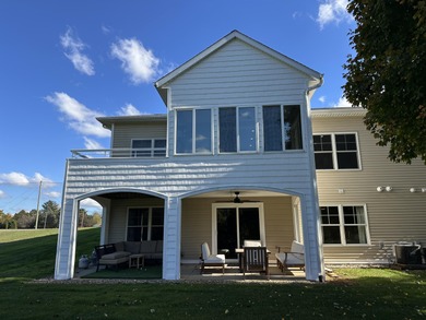 This home overlooks the pristine Lake Michigan Hills Golf Course - photo 4