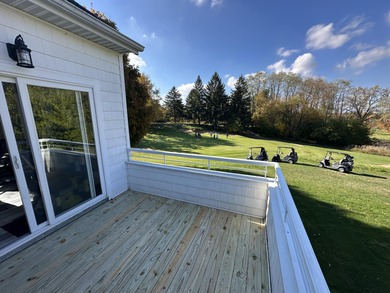 This home overlooks the pristine Lake Michigan Hills Golf Course - photo 6