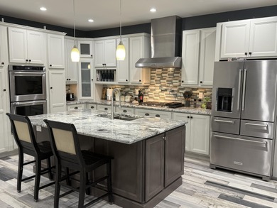 This home overlooks the pristine Lake Michigan Hills Golf Course - photo 9