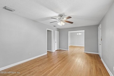 As you enter this well maintained home on a quiet street, the - photo 2