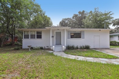 As you enter this well maintained home on a quiet street, the - photo 5