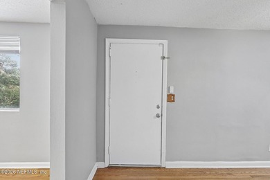 As you enter this well maintained home on a quiet street, the - photo 7
