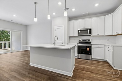Welcome home to 20 Hidden Pointe Drive! This three-story - photo 5