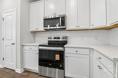 Welcome home to 20 Hidden Pointe Drive! This three-story - photo 9