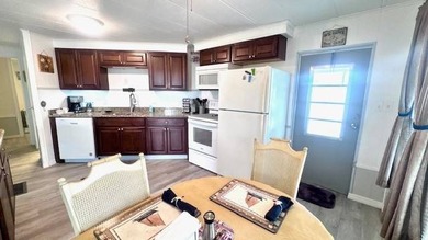 This charming 2-bedroom, 1.5-bath manufactured home offers - photo 4