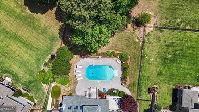 Golf-front Bentwater brick home with a private pool, a three-car - photo 4