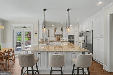 Golf-front Bentwater brick home with a private pool, a three-car - photo 8