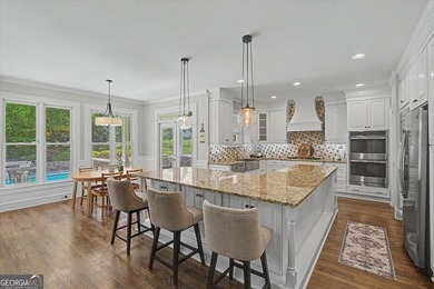 Golf-front Bentwater brick home with a private pool, a three-car - photo 9