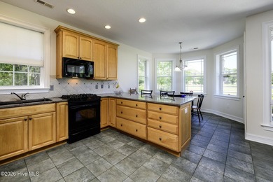 Sunlight pours through oversized windows, casting peaceful water - photo 21