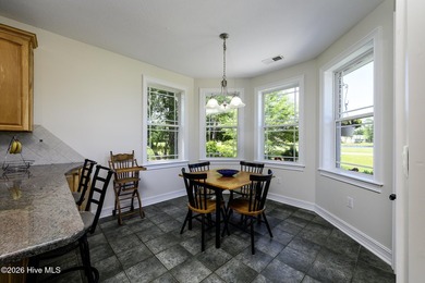Sunlight pours through oversized windows, casting peaceful water - photo 22