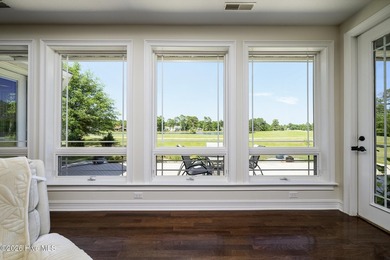Sunlight pours through oversized windows, casting peaceful water - photo 26