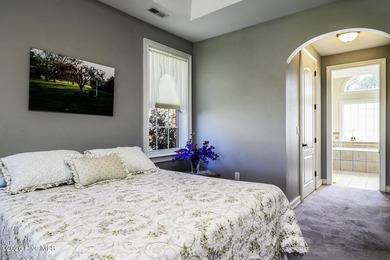 Sunlight pours through oversized windows, casting peaceful water - photo 35