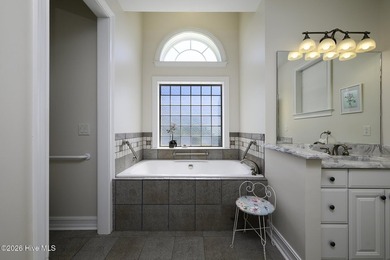 Sunlight pours through oversized windows, casting peaceful water - photo 36