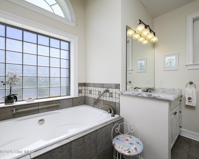 Sunlight pours through oversized windows, casting peaceful water - photo 38