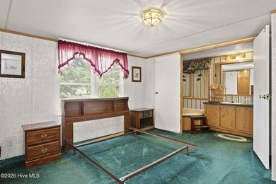 This 3 bedroom, 2 bathroom partially furnished home is an - photo 11