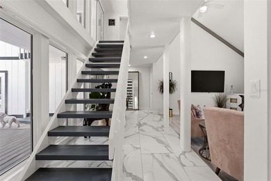 Hidden behind an expansive 250-foot circular driveway, the - photo 25
