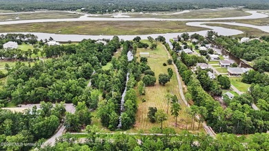 Discover a rare opportunity to own 12.65 acres of waterfront - photo 3