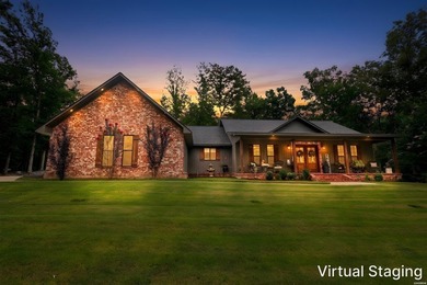 Built in 2022 and tucked away on 4.87+/- secluded acres, this - photo 1