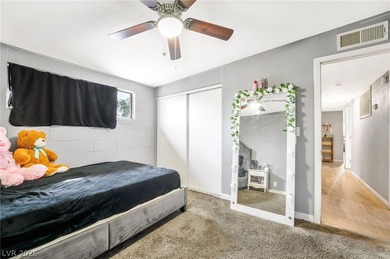 This single-story home offers three bedrooms and two full