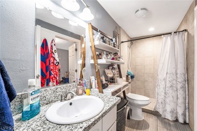 This single-story home offers three bedrooms and two full