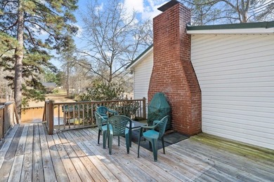 Tucked along the water's edge, this charming rustic cottage is - photo 7