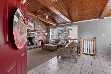 Tucked along the water's edge, this charming rustic cottage is - photo 9
