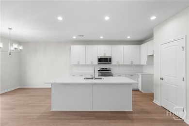 The Hatteras floorplan by Smith Family Homes is under - photo 6