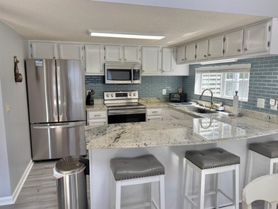 Updated townhome with new grey weathered-looking LVP flooring - photo 11