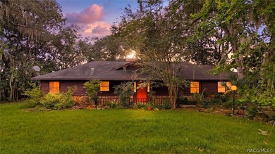 Nestled beneath a canopy of majestic oak trees and overlooking - photo 1