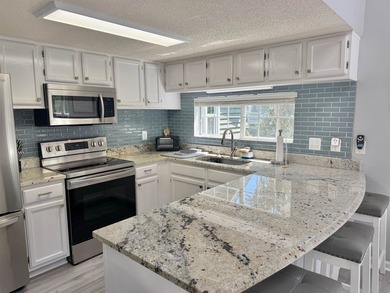 Updated townhome with new grey weathered-looking LVP flooring - photo 12