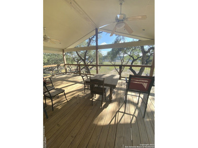 Nestled along the serene shores of Medina Lake, this charming - photo 3