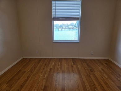 This beautiful 4-bedroom, 2-bath lakefront home sits on a - photo 19