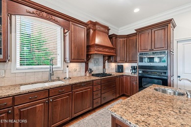 Enjoy peaceful lakefront living in this custom brick and stone - photo 34
