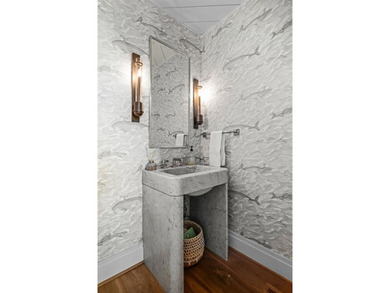 This iconic Lakewood residence masterfully blends historic charm