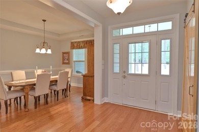 Peaceful Luxury awaits on a 1.4-acre lot in the gated community