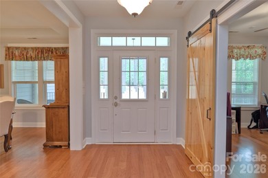 Peaceful Luxury awaits on a 1.4-acre lot in the gated community