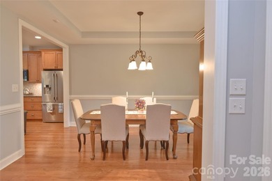 Peaceful Luxury awaits on a 1.4-acre lot in the gated community