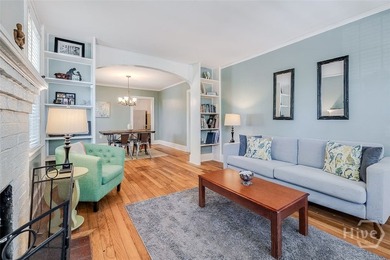 Built in 1923, this charming brick bungalow delivers the - photo 3