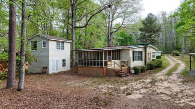Check out this Lake Sinclair home overlooking peaceful water - photo 1