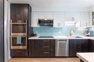 Welcome to this beautifully remodeled condominium in the highly - photo 1