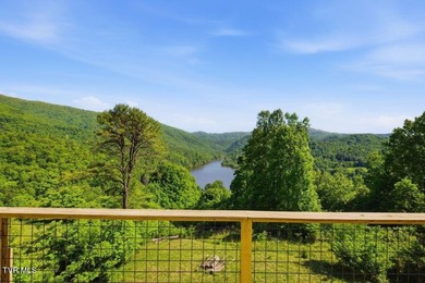 Perched above the crystal-clear waters of Watauga Lake, this - photo 21