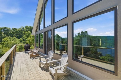 Perched above the crystal-clear waters of Watauga Lake, this - photo 23