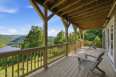 Perched above the crystal-clear waters of Watauga Lake, this - photo 40