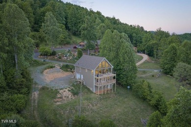 Perched above the crystal-clear waters of Watauga Lake, this - photo 47