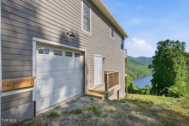 Perched above the crystal-clear waters of Watauga Lake, this - photo 50